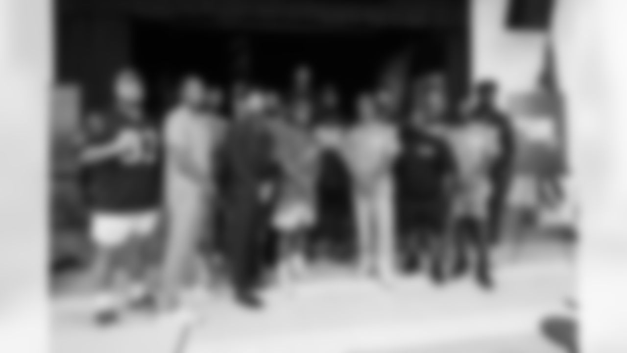 A September 12, 2023 image from the Texans Care CoolxDad picture day and Flag-in-Schools clinic at Blackshear Elementary School in Houston, TX.