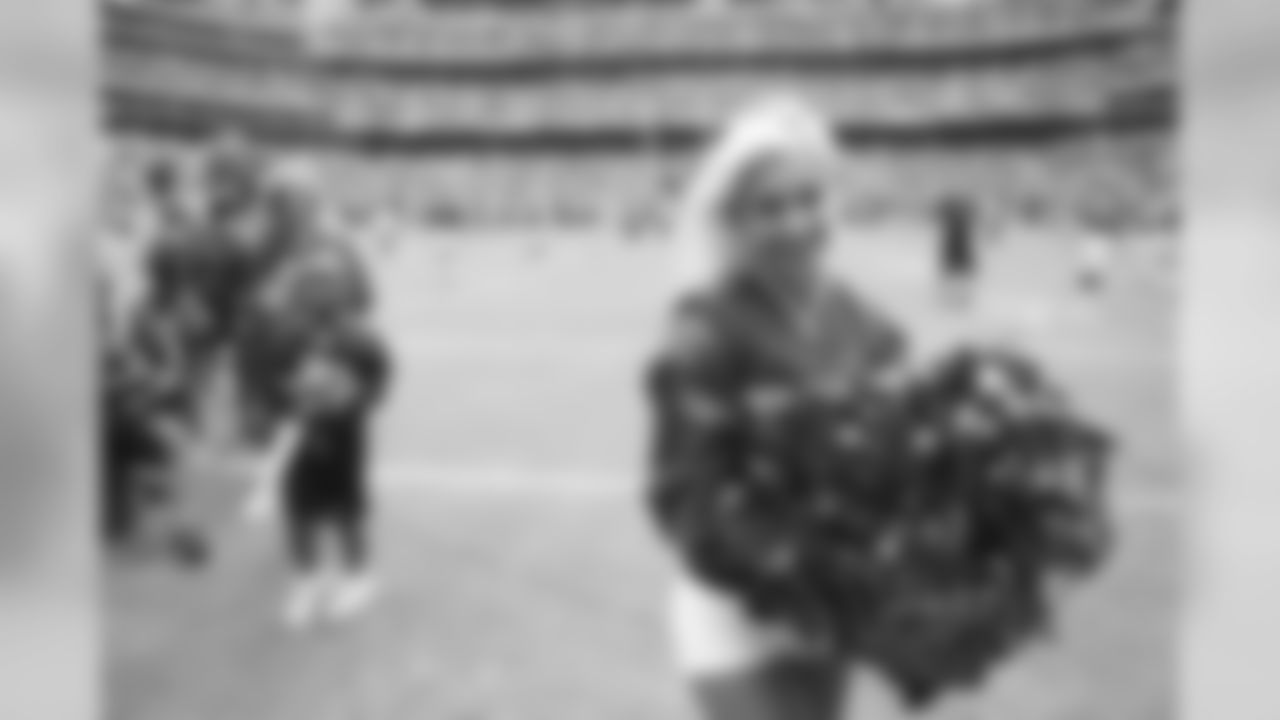 Before the start of the game against the Titans, Lindsay smiles during introductions.