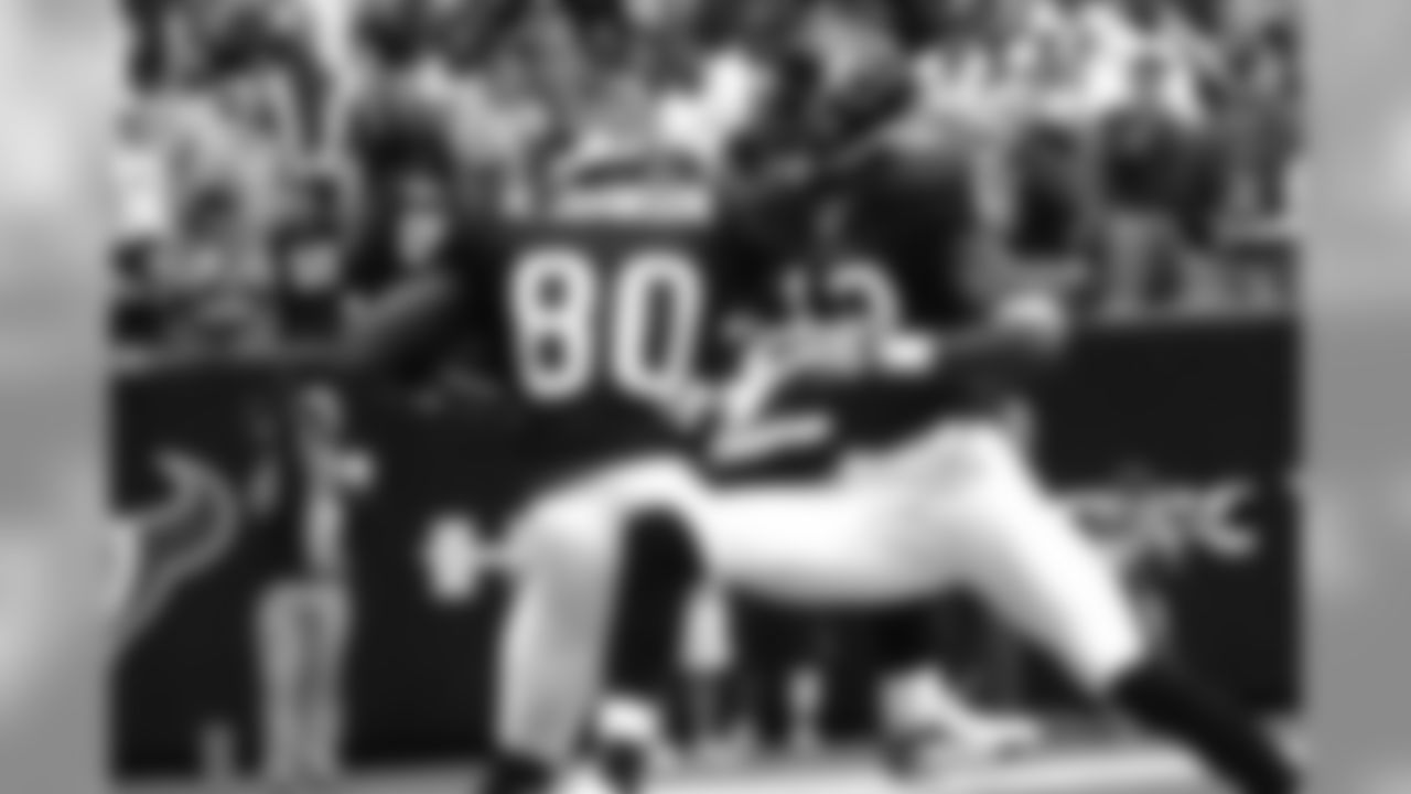 Andre Johnson and Jacoby Jones leap in excitement over Johnson's 73-yard touchdown catch.