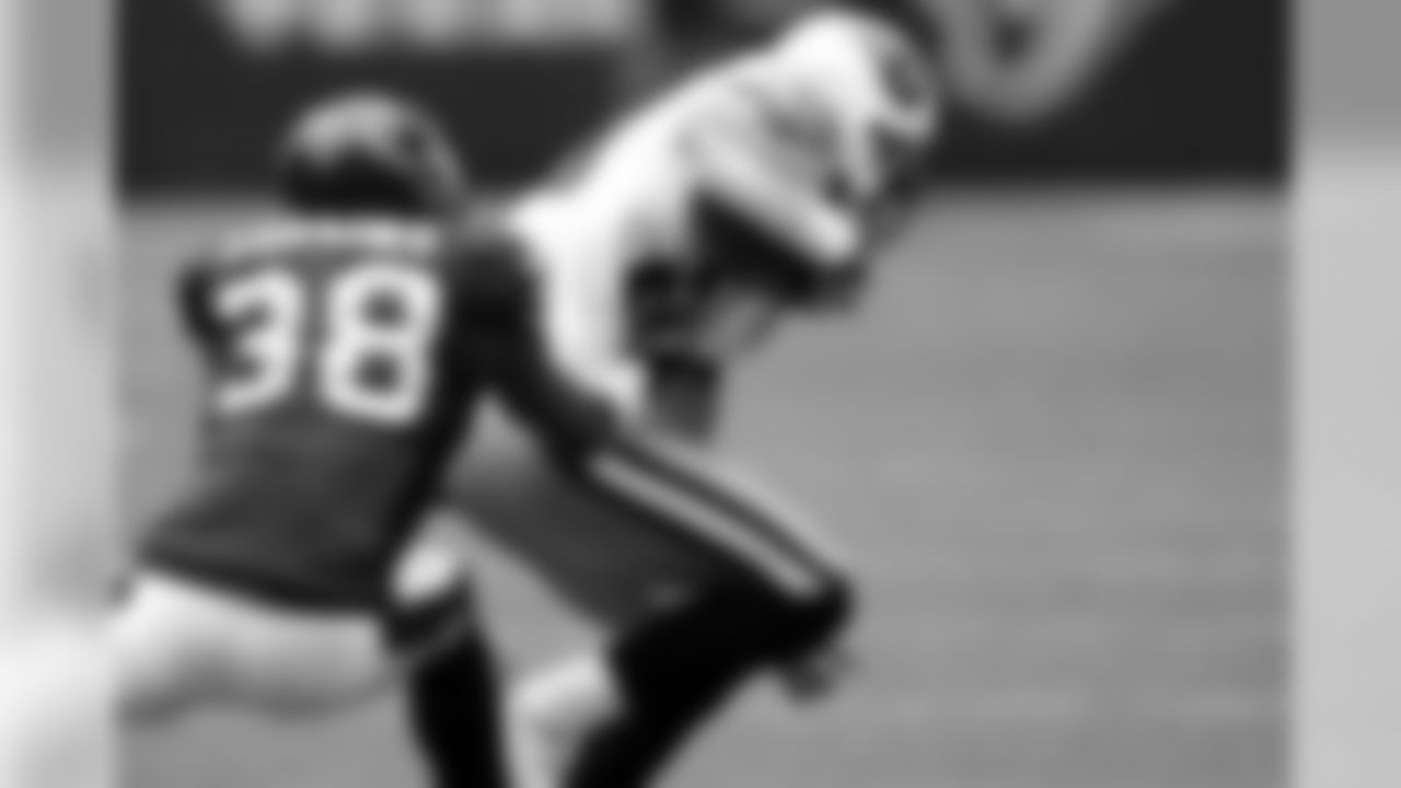Cornerback DeMarcus Faggins makes a play on a Titans wide receiver.