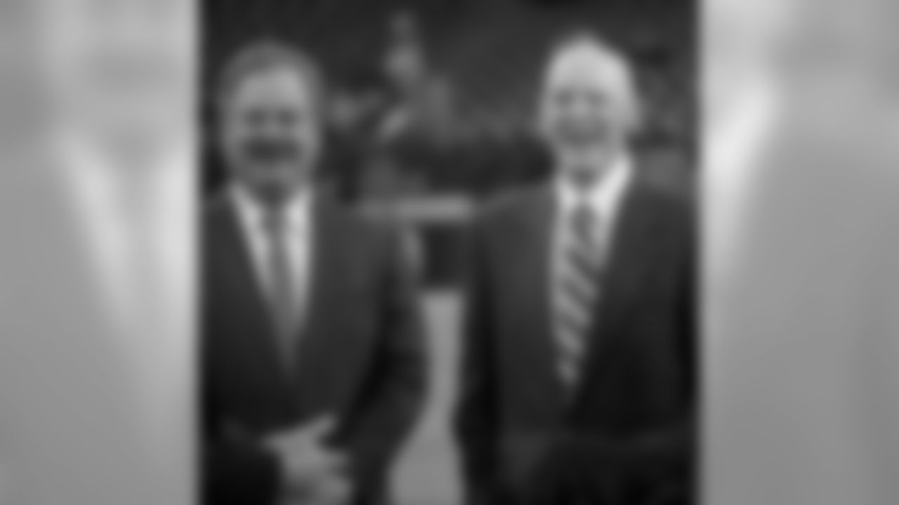 Houston Texans owner Bob McNair, right, is joined by his son, Cal, left, before an NFL football game against the Baltimore Ravens Sunday, Dec. 21, 2014, in Houston. (AP Photo/David J. Phillip)