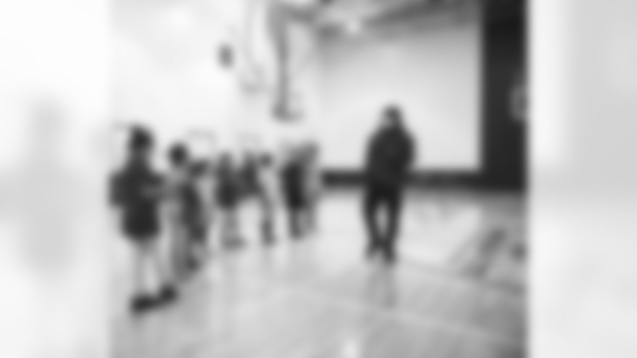 An image from the Dec. 14, 2021 Houston Texans Community Development event. Desmond King gave gifts and played games with local Boys and Girls Club students.