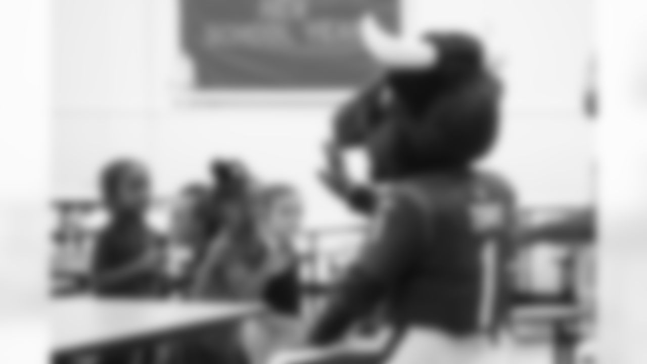 A September 12, 2023 image from the Texans Care CoolxDad picture day and Flag-in-Schools clinic at Blackshear Elementary School in Houston, TX.