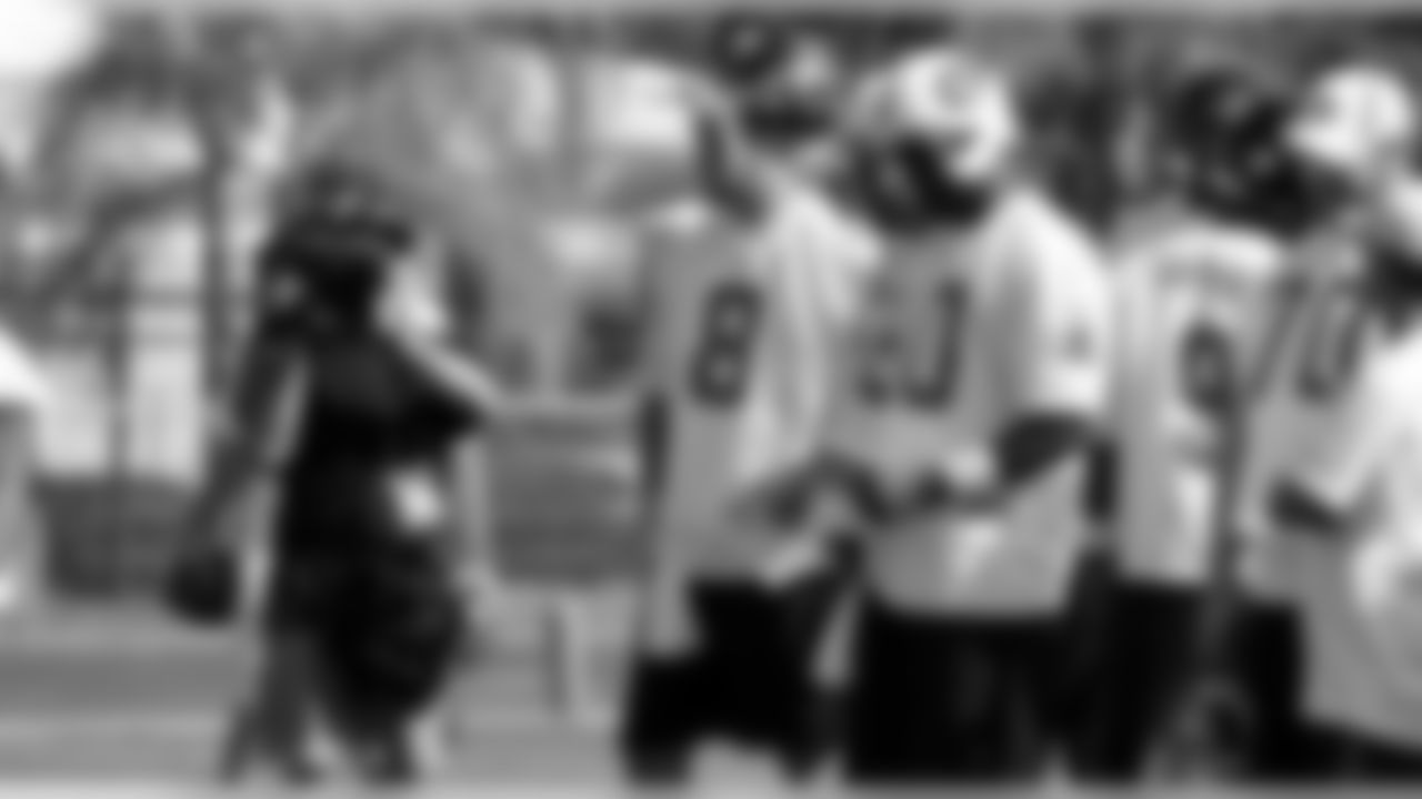 Texans quarterback Matt Schaub stands next to Titans quarterback Vince Young.