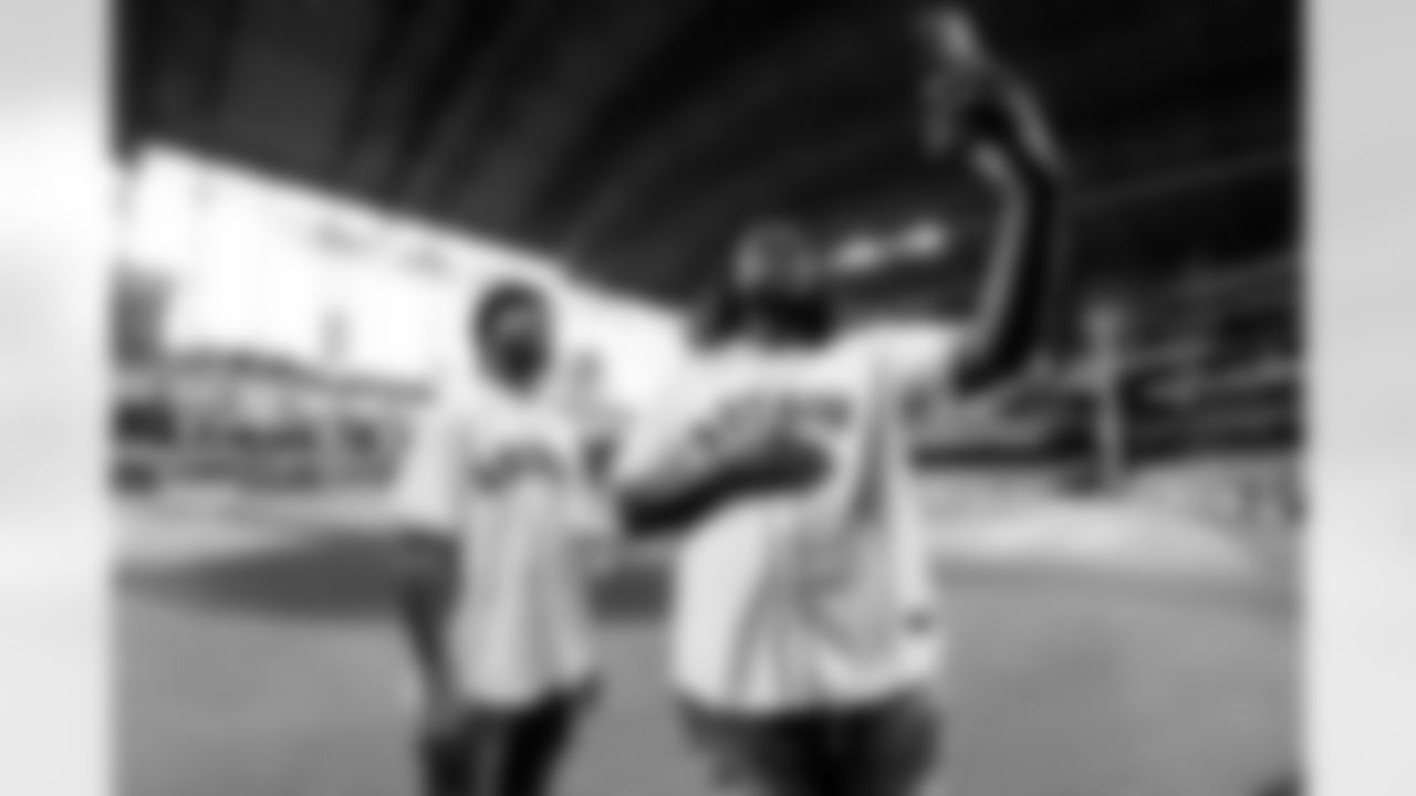 An image from rookies Derek Stingley Jr. and Kenyon Green throwing out the first pitch at the Astros game at Minute Maid Park in Houston, TX.