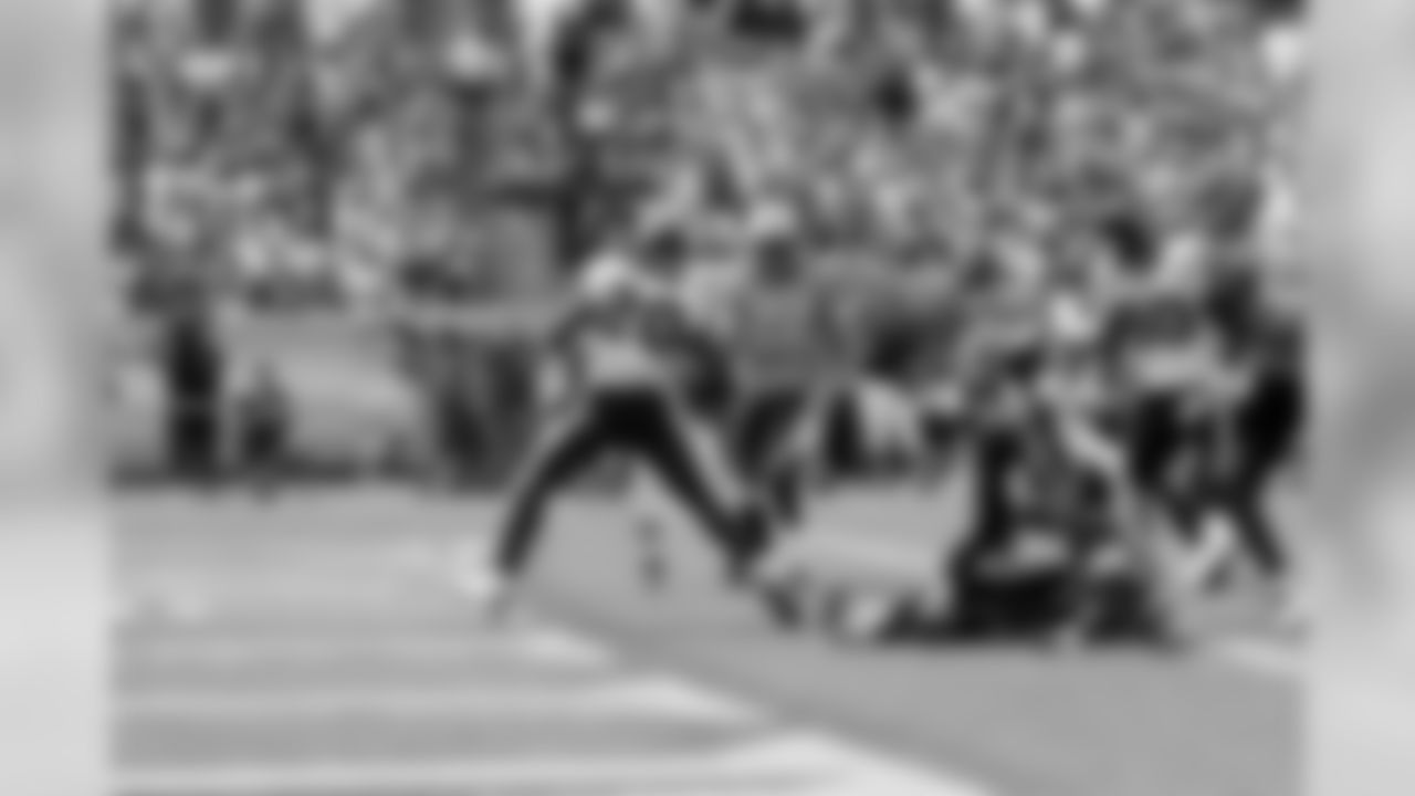 Steve Slaton celebrates in the end zone.