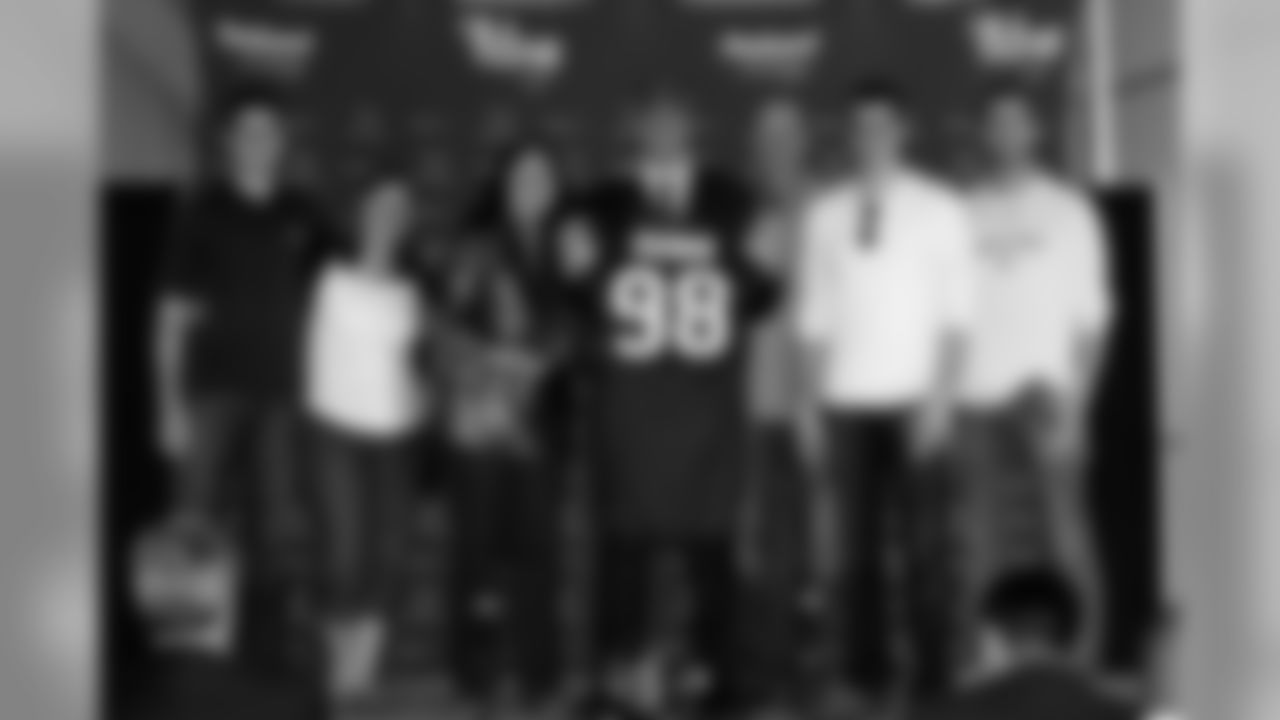 Barwin and his six family members, including his godmother