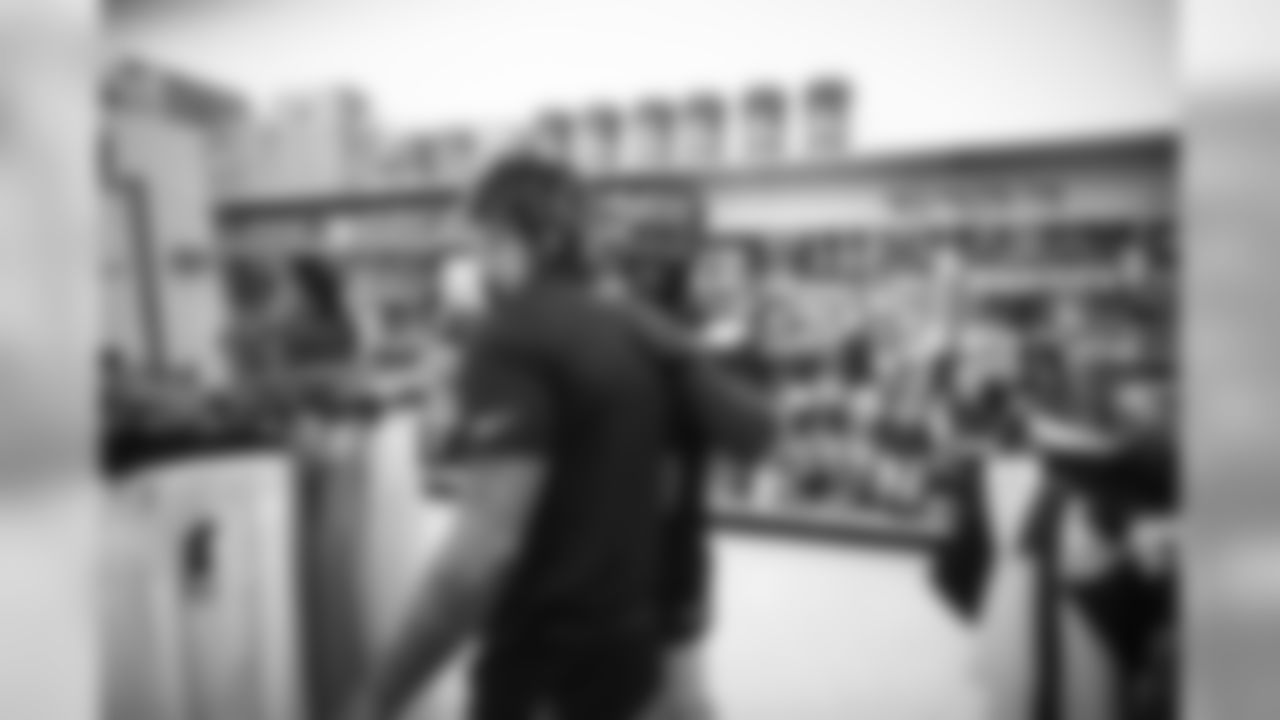 A July 23, 2018 photo from a community development event at Academy Sports and Outdoors in Humble, TX featuring Tyrann Mathieu.