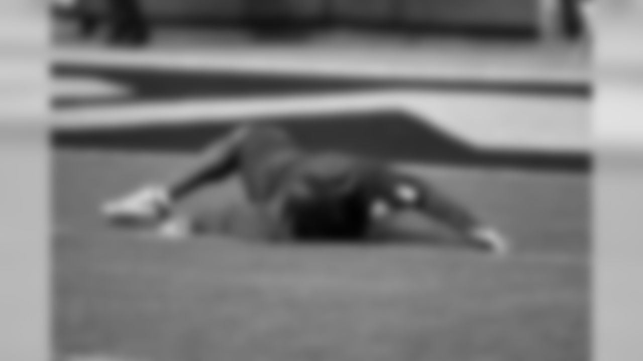 Leach stretches on the field at McAfee Coliseum.