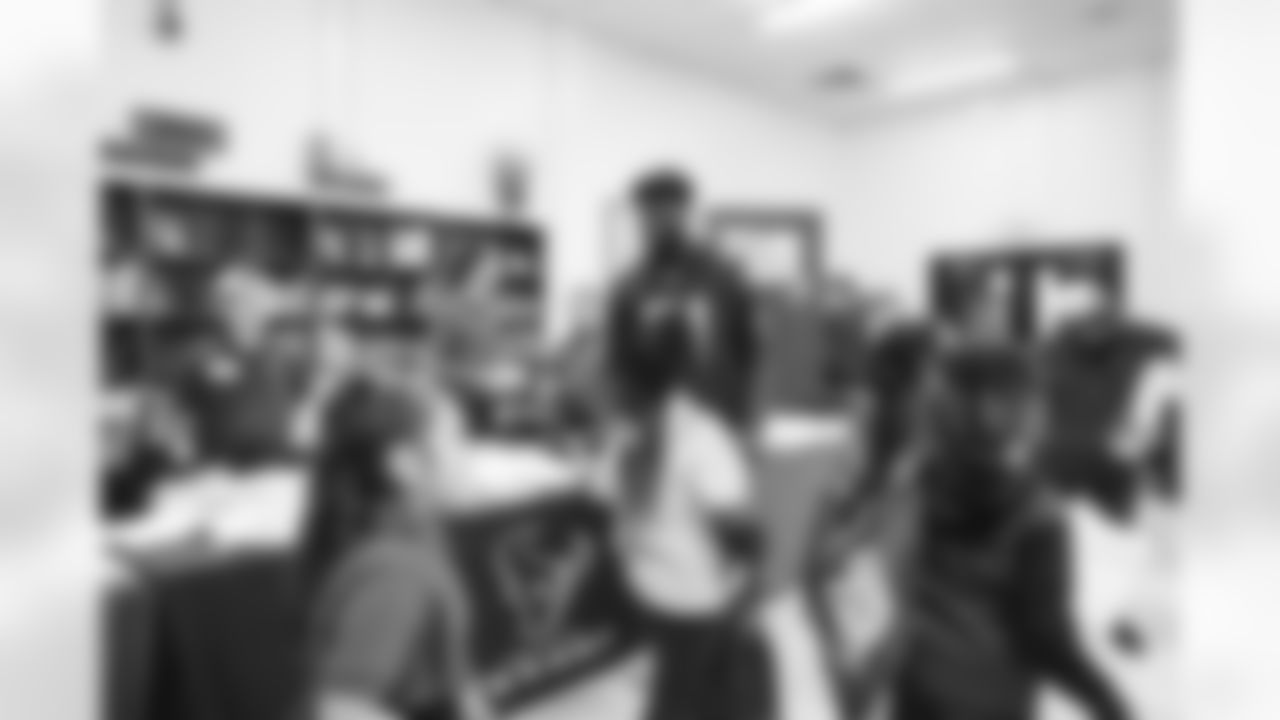 A September 12, 2023 image from the Texans Care CoolxDad picture day and Flag-in-Schools clinic at Blackshear Elementary School in Houston, TX.