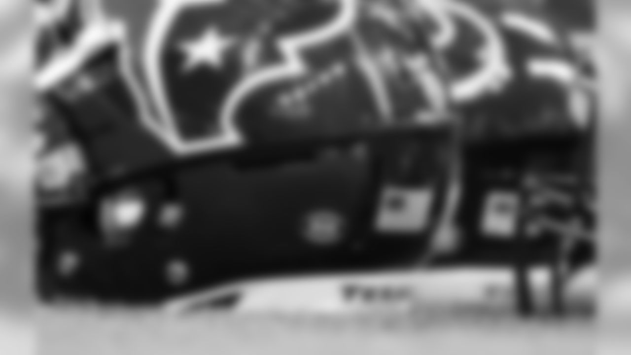 A decal with the initials of Houston Texans owner Robert "Bob" McNair are seen on team helmets prior to an NFL football game between the Houston Texans and the Tennessee Titans, Monday, Nov. 26, 2018, in Houston. McNair had battled both leukemia and squamous cell carcinoma in recent years before dying in Houston on Friday, Nov. 23, 2018. (AP Photo/David J. Phillip)