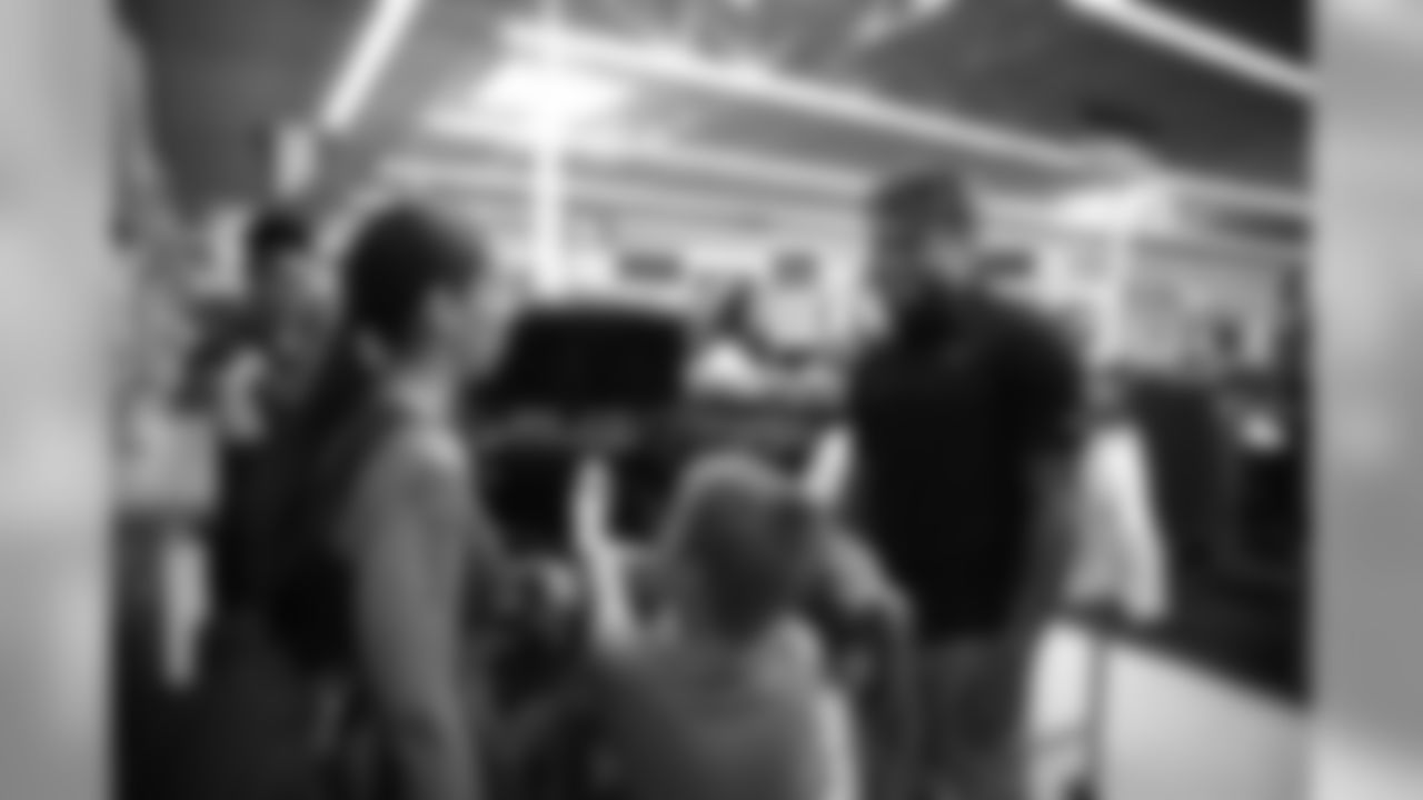A July 23, 2018 photo from a community development event at Academy Sports and Outdoors in Humble, TX featuring Tyrann Mathieu.