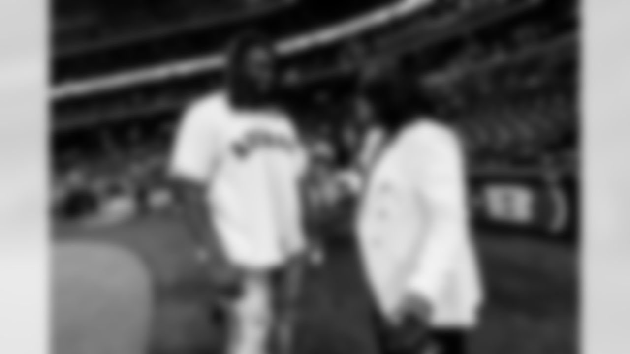 An image from rookies Derek Stingley Jr. and Kenyon Green throwing out the first pitch at the Astros game at Minute Maid Park in Houston, TX.