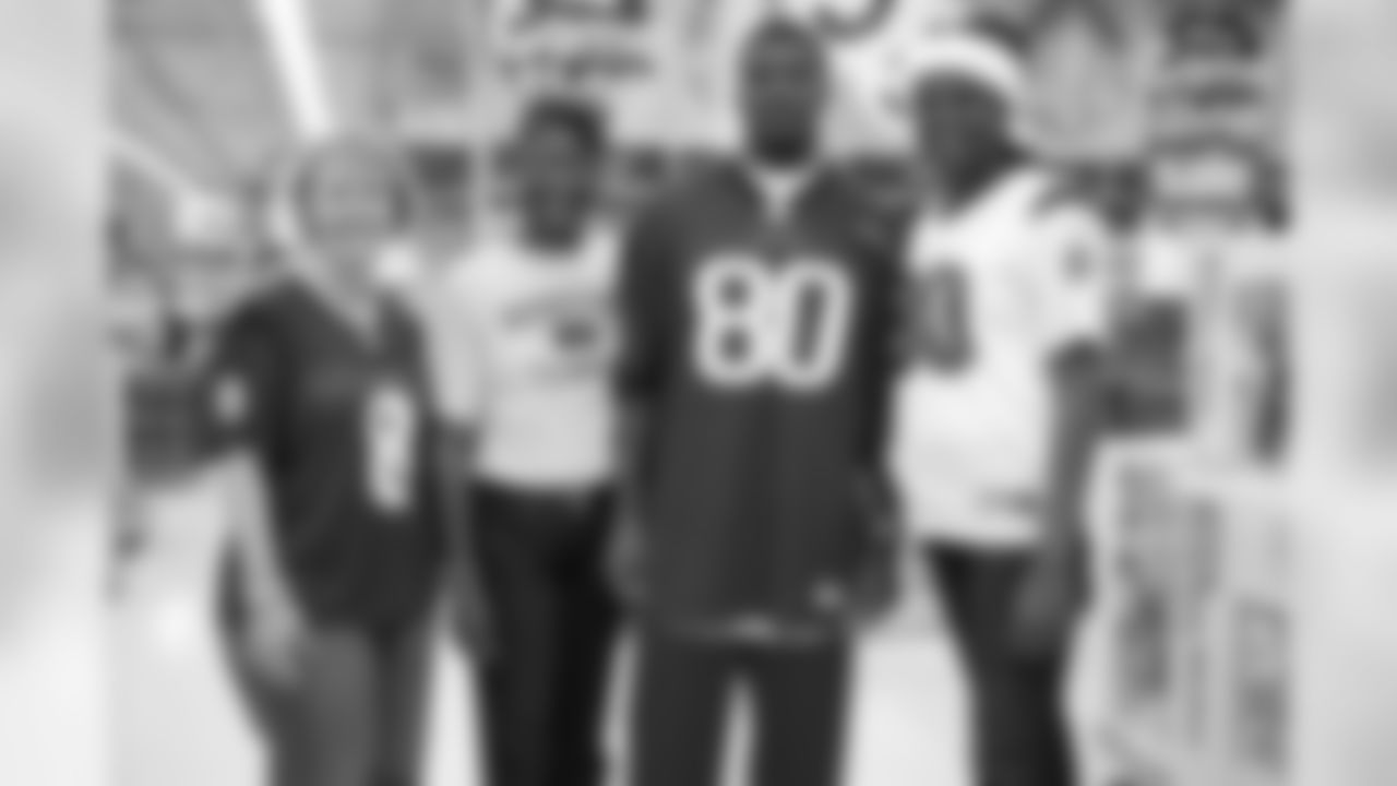 Johnson with his mother and, from left, the mothers of quarterback Matt Schaub and wide receiver Jacoby Jones