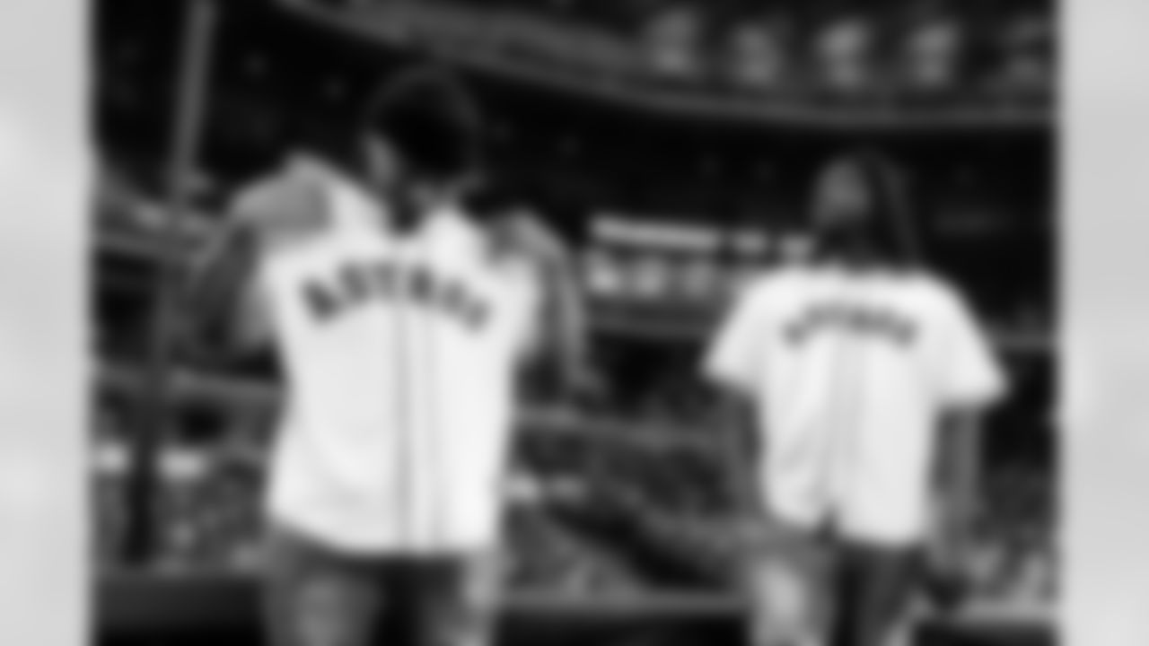 An image from rookies Derek Stingley Jr. and Kenyon Green throwing out the first pitch at the Astros game at Minute Maid Park in Houston, TX.