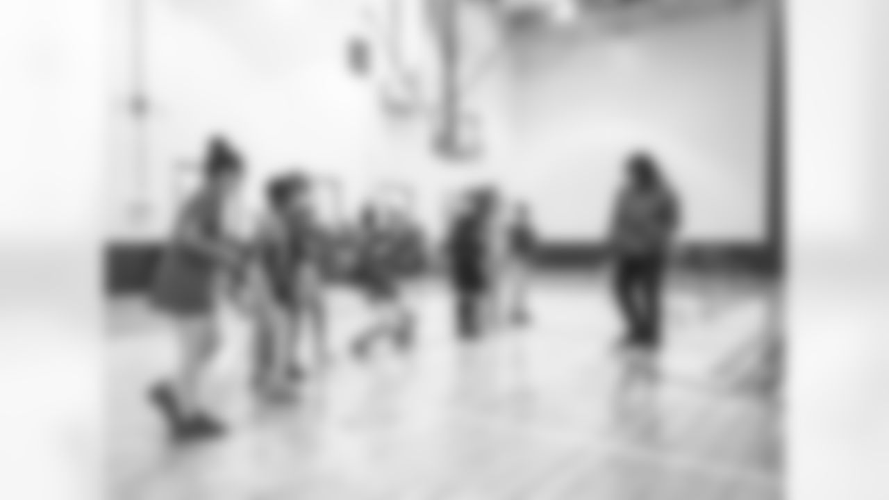 An image from the Dec. 14, 2021 Houston Texans Community Development event. Desmond King gave gifts and played games with local Boys and Girls Club students.