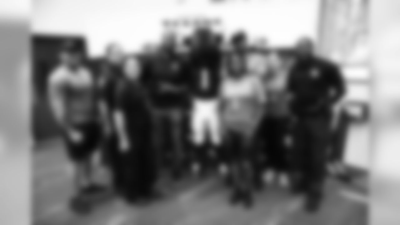 An image from the Sept. 24, 2019 community event in which Texans Rookies and HPD officers participated in football drills with students at Emancipation Park.