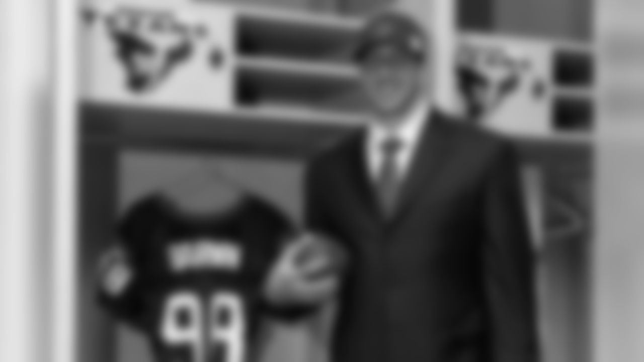 Texans second-round pick defensive end Connor Barwin in front of his locker and No. 98 jersey