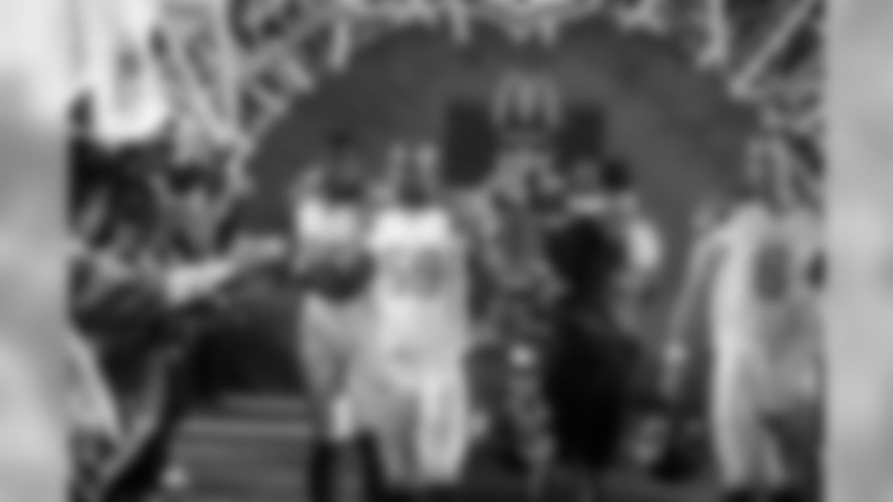 Left to right: Andre Johnson, DeMeco Ryans and Matt Schaub come out of the tunnel together during pre-game introductions.