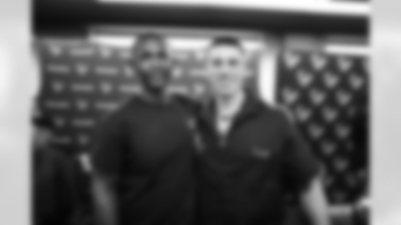 An image from the June 16, 2022 community development event, "Coach's Cuts", at Star of Hope in Houston Texas. Texans' Special Teams Coordinator, Frank Ross, led a haircut program for the Star of Hope residents.