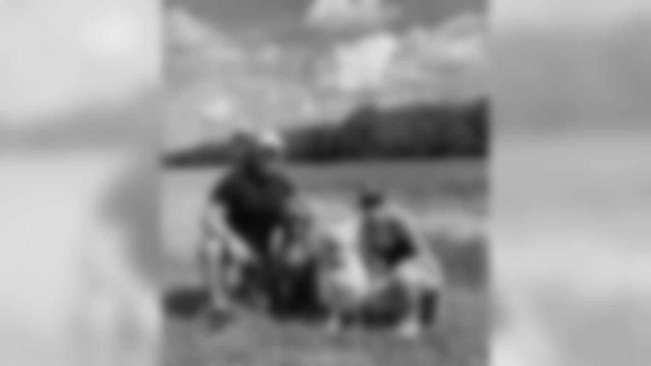 J.J. Watt and Kealia Ohai and their dogs Tex and Fin.
