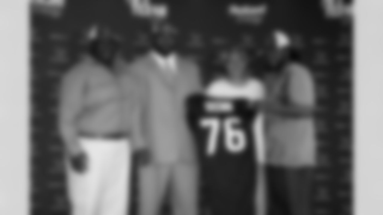 Brown and his family - father, Dennis, mother, Myra, and brother, Marlon