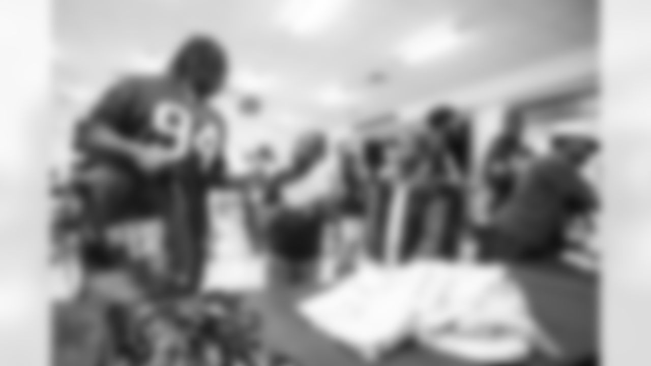 A September 12, 2023 image from the Texans Care CoolxDad picture day and Flag-in-Schools clinic at Blackshear Elementary School in Houston, TX.