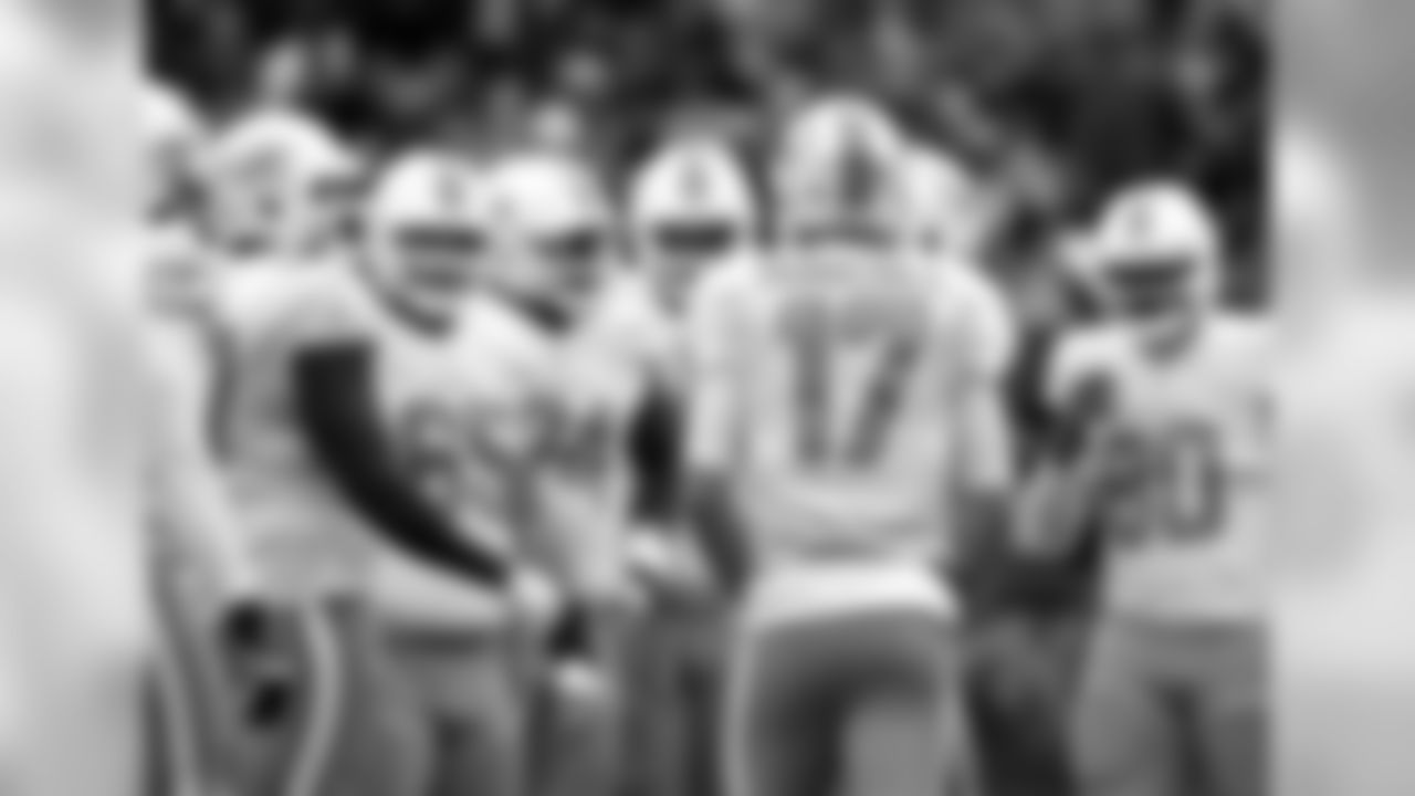Miami Dolphins quarterback Ryan Tannehill (17) huddles with teammates in the first half of an NFL football game against the Baltimore Ravens, Sunday, Dec. 4, 2016, in Baltimore. (AP Photo/Gail Burton)
