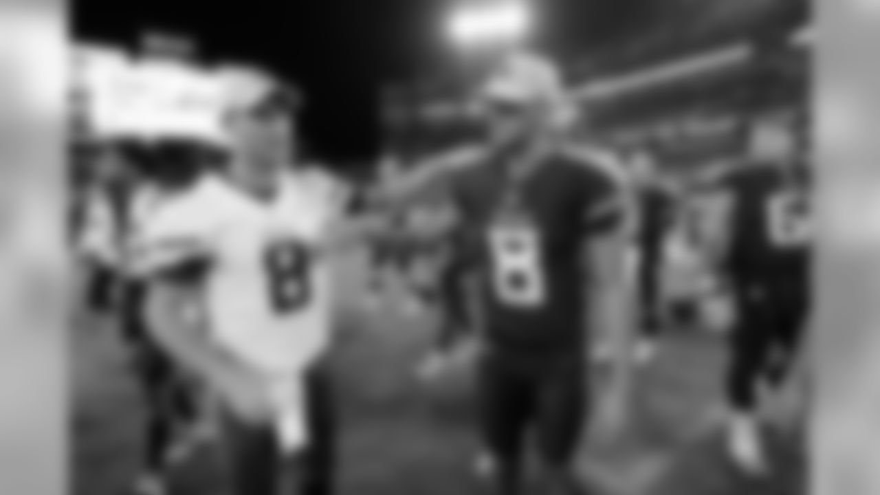 Minnesota Vikings quarterback Kirk Cousins, left, shakes hands with Tennessee Titans quarterback Marcus Mariota, right, after a preseason NFL football game Thursday, Aug. 30, 2018, in Nashville, Tenn. The Vikings won 13-3. (AP Photo/Mark Zaleski)