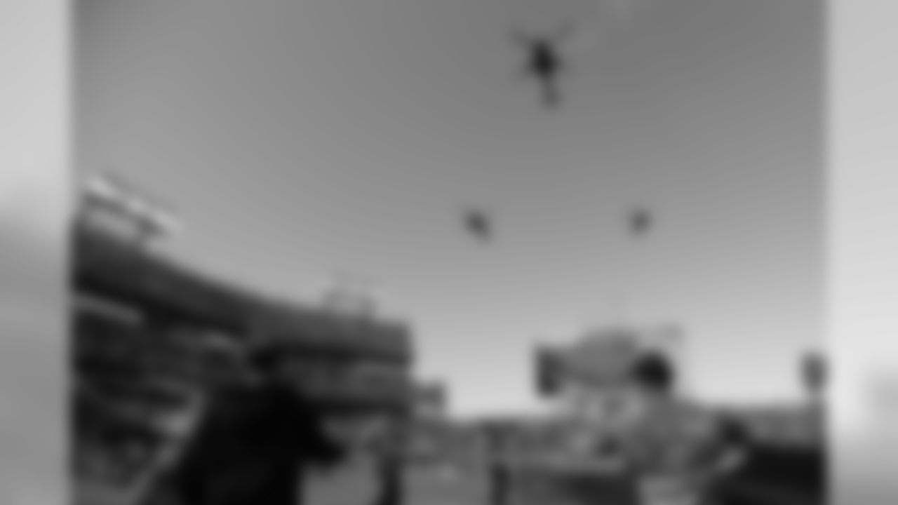 Military helicopters fly over Nissan Stadium during a Salute to Service ceremony before an NFL football game between the Tennessee Titans and the New England Patriots Sunday, Nov. 11, 2018, in Nashville, Tenn. (AP Photo/Mark Zaleski)