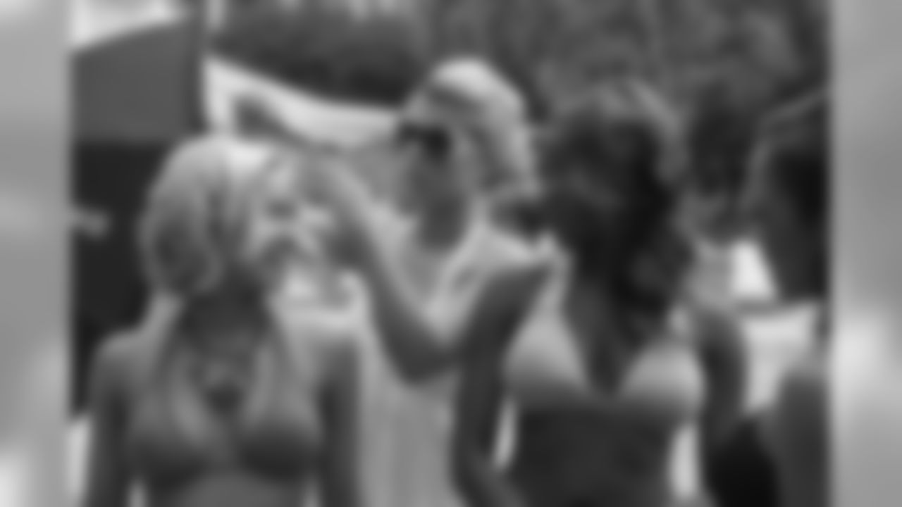 Tennessee Titans cheerleaders take part in a photo shoot Wednesday morning at the Sandestin Golf and Beach Resort.