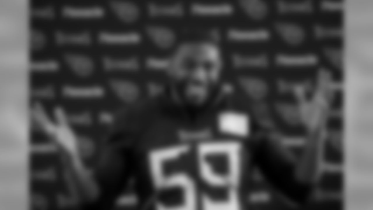 Tennessee Titans' linebacker Wesley Woodyard gives a press conference after an NFL training session at Syon House, in Syon Park, south west London, Friday, Oct. 19, 2018. The Tennessee Titans are preparing for an NFL regular season game against the Los Angeles Chargers in London on Sunday. (AP Photo/Matt Dunham)