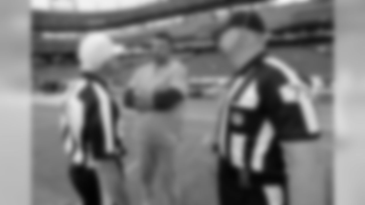 Tennessee Titans head coach Mike Vrabel, center, talks with referee Walt Coleman, left, and line judge Mark Stewart (75) before a preseason NFL football game against the Minnesota Vikings Thursday, Aug. 30, 2018, in Nashville, Tenn. (AP Photo/Mark Zaleski)