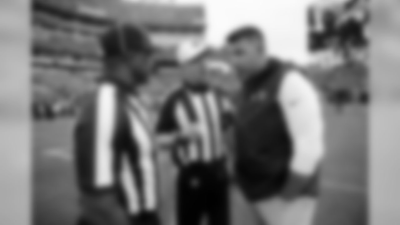 Tennessee Titans head coach Mike Vrabel, right, talks with referee Carl Cheffers, center, and umpire Barry Anderson, left, before an NFL football game between the Titans and the Baltimore Ravens Sunday, Oct. 14, 2018, in Nashville, Tenn. (AP Photo/James Kenney)