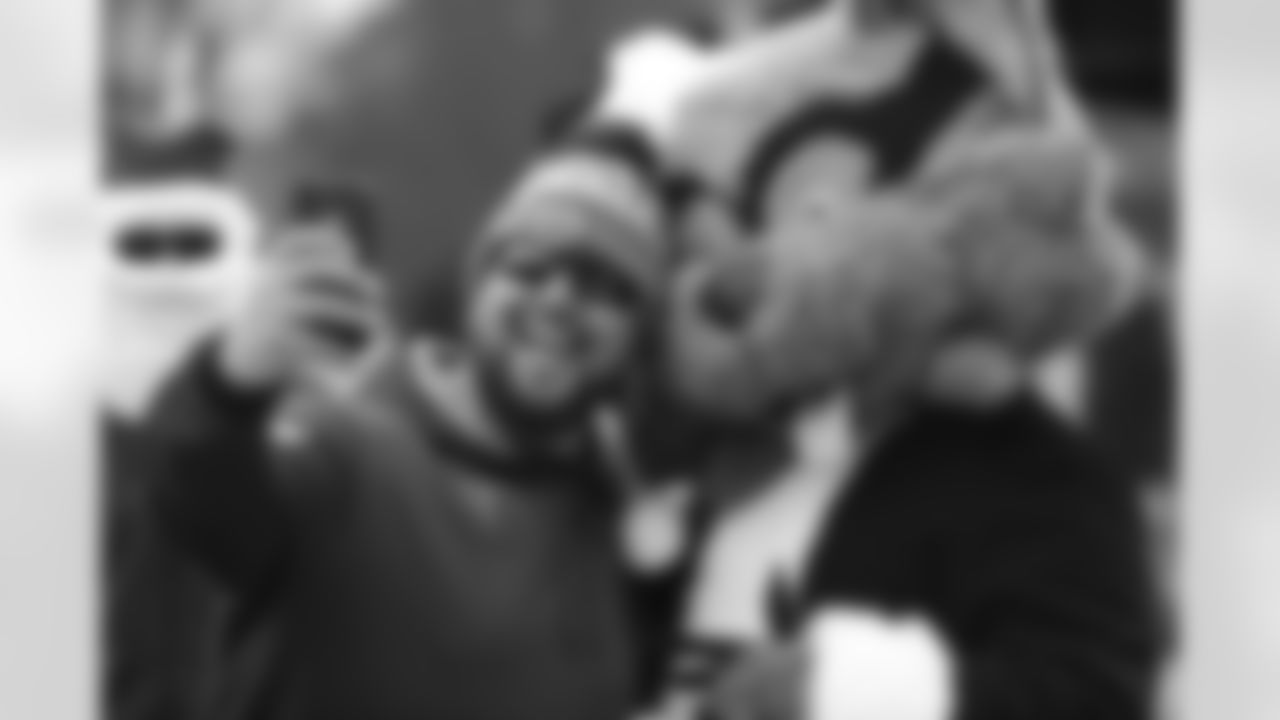 Tennessee Titans fan Guy Fogg takes a selfie with Titans mascot T-Rac before an NFL football game between the Titans and the Los Angeles Rams Sunday, Dec. 24, 2017, in Nashville, Tenn. (AP Photo/James Kenney)