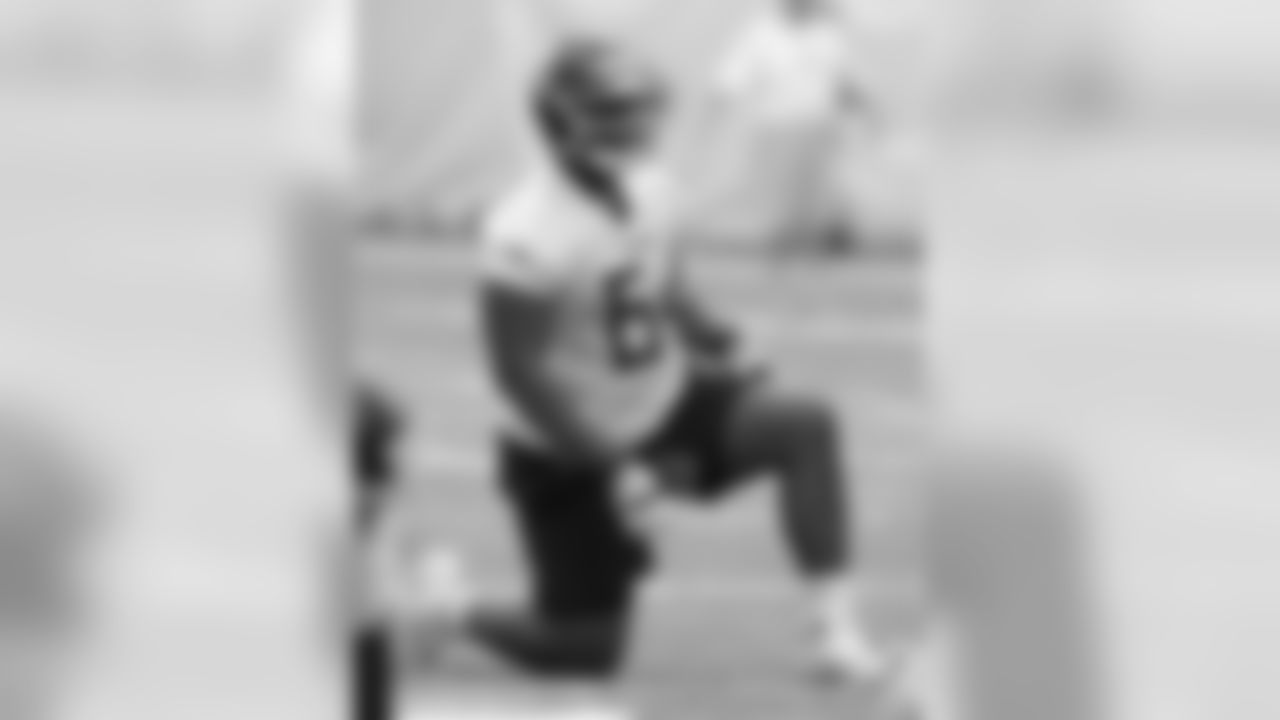 Tennessee Titans offensive lineman Nate Davis stretches during NFL football rookie minicamp Saturday, May 11, 2019, in Nashville, Tenn. (AP Photo/Mark Zaleski)