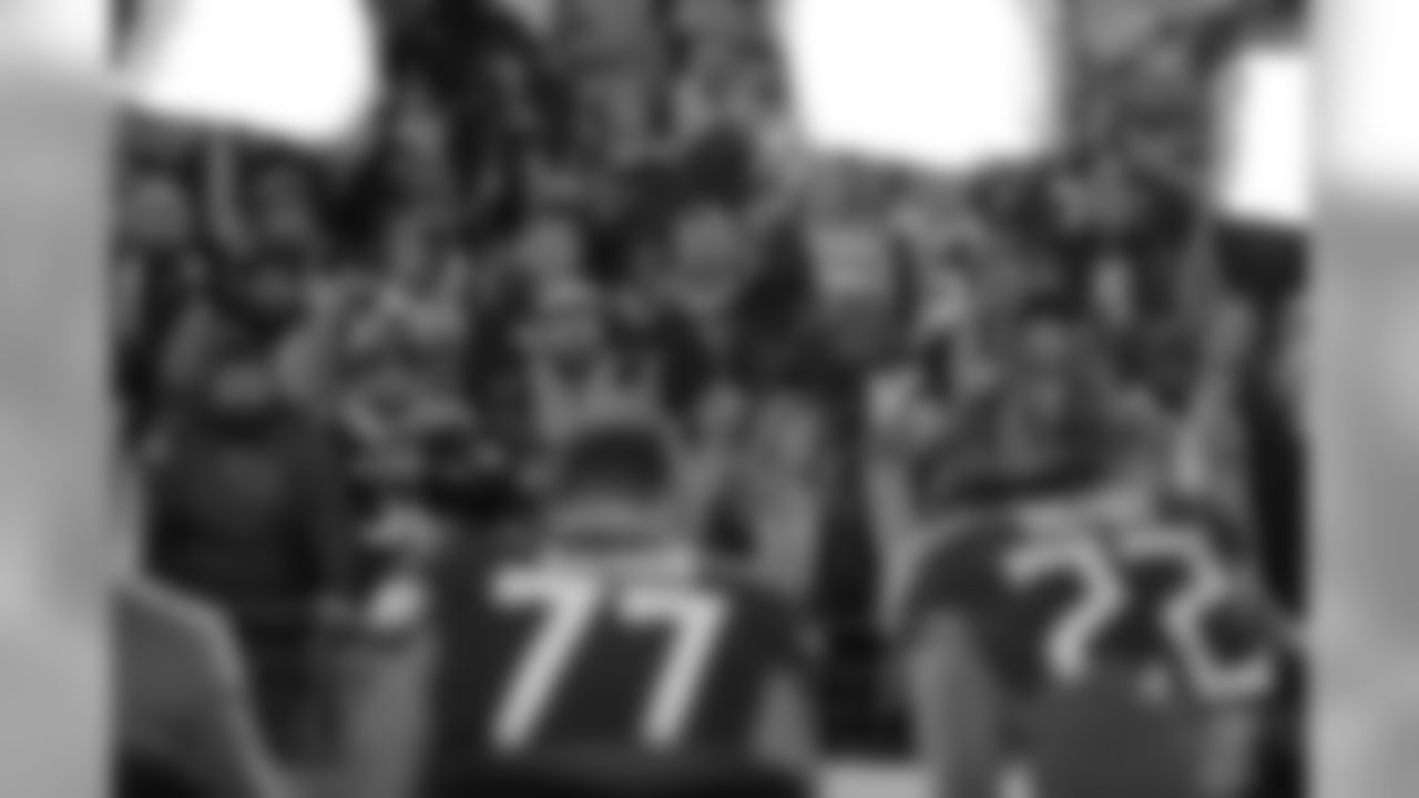 Fans cheer as NFL broadcasters work after an NFL football game between the Tennessee Titans and the Jacksonville Jaguars, Thursday, Dec. 6, 2018, in Nashville, Tenn. The Tennessee Titans won 30-9. (AP Photo/James Kenney)