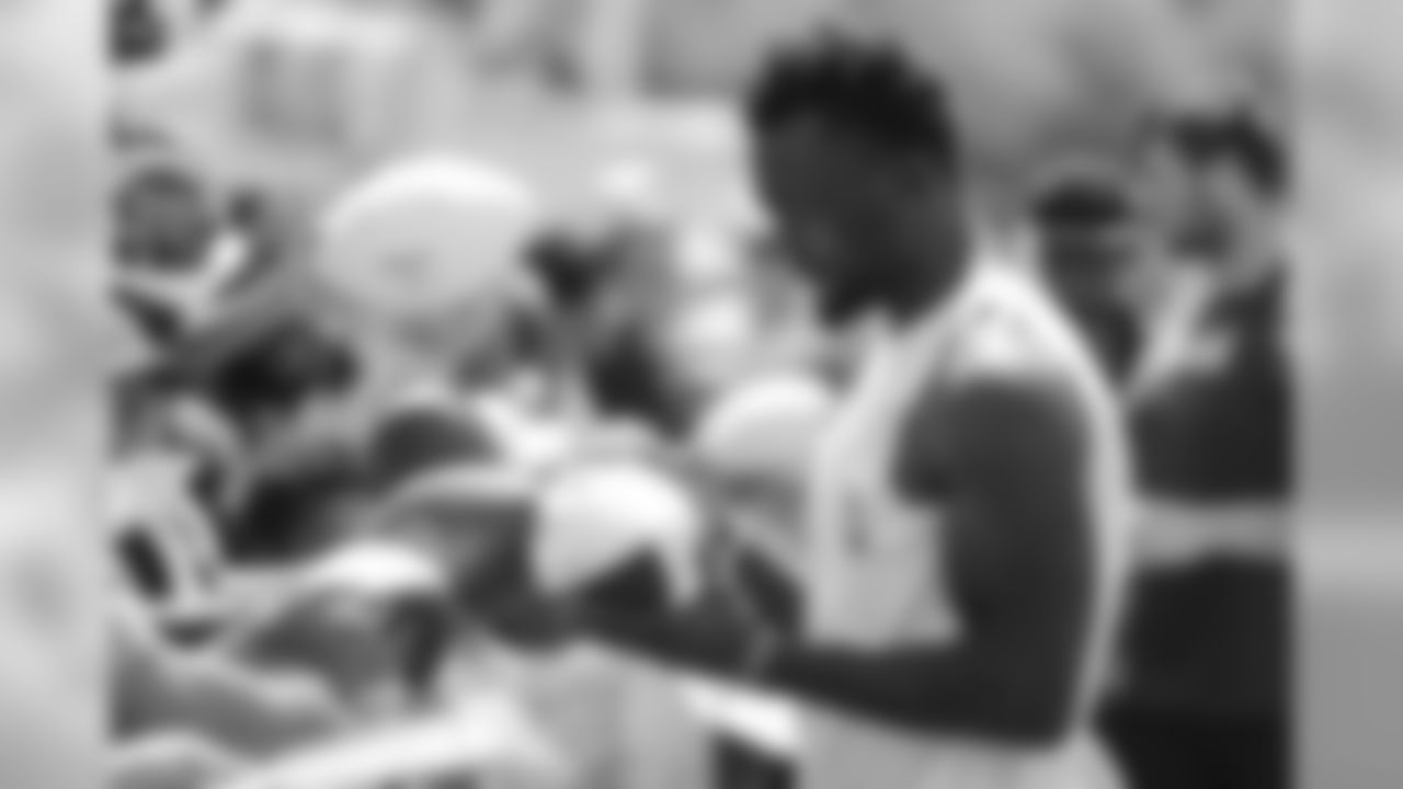 NASHVILLE, TN - AUGUST 14, 2019 - Wide receiver Corey Davis #84 of Tennessee Titans signing autographs with fans during training camp joint practice with the New England Patriots at Saint Thomas Sports Park in Nashville, TN. Photo By Donald Page/Tennessee Titans