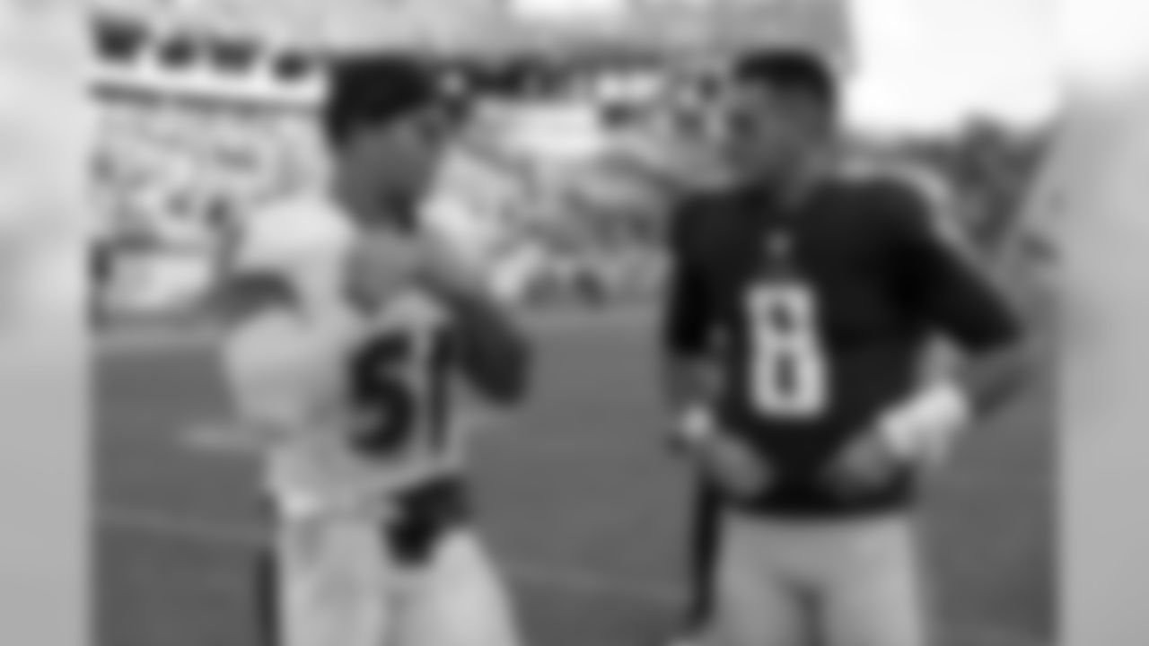Baltimore Ravens inside linebacker Kamalei Correa (51) talks with Tennessee Titans quarterback Marcus Mariota (8) after an NFL football game Sunday, Nov. 5, 2017, in Nashville, Tenn. The Titans won 23-20. (AP Photo/James Kenney)