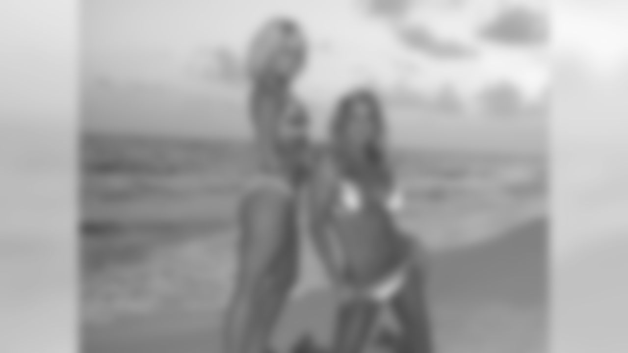 Tennessee Titans cheerleaders take part in a sunset photo shoot Tuesday afternoon at the Sandestin Golf and Beach Resort.