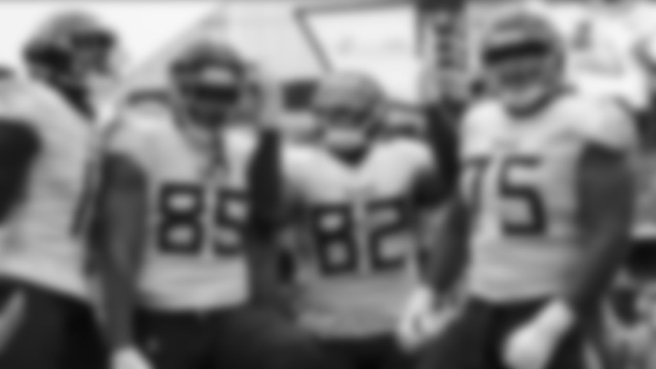 Tennessee Titans tight end Delanie Walker, middle, makes a catch for a touchdown and celebrates with wide receiver A.J. Brown, left, tight end MyCole Pruitt, middle left, and offensive guard Jamil Douglas, right, during an NFL football game against the Cleveland Browns, Sunday, Sept. 8, 2019, in Cleveland. Tennessee won 43-13. (Aaron Doster via AP)