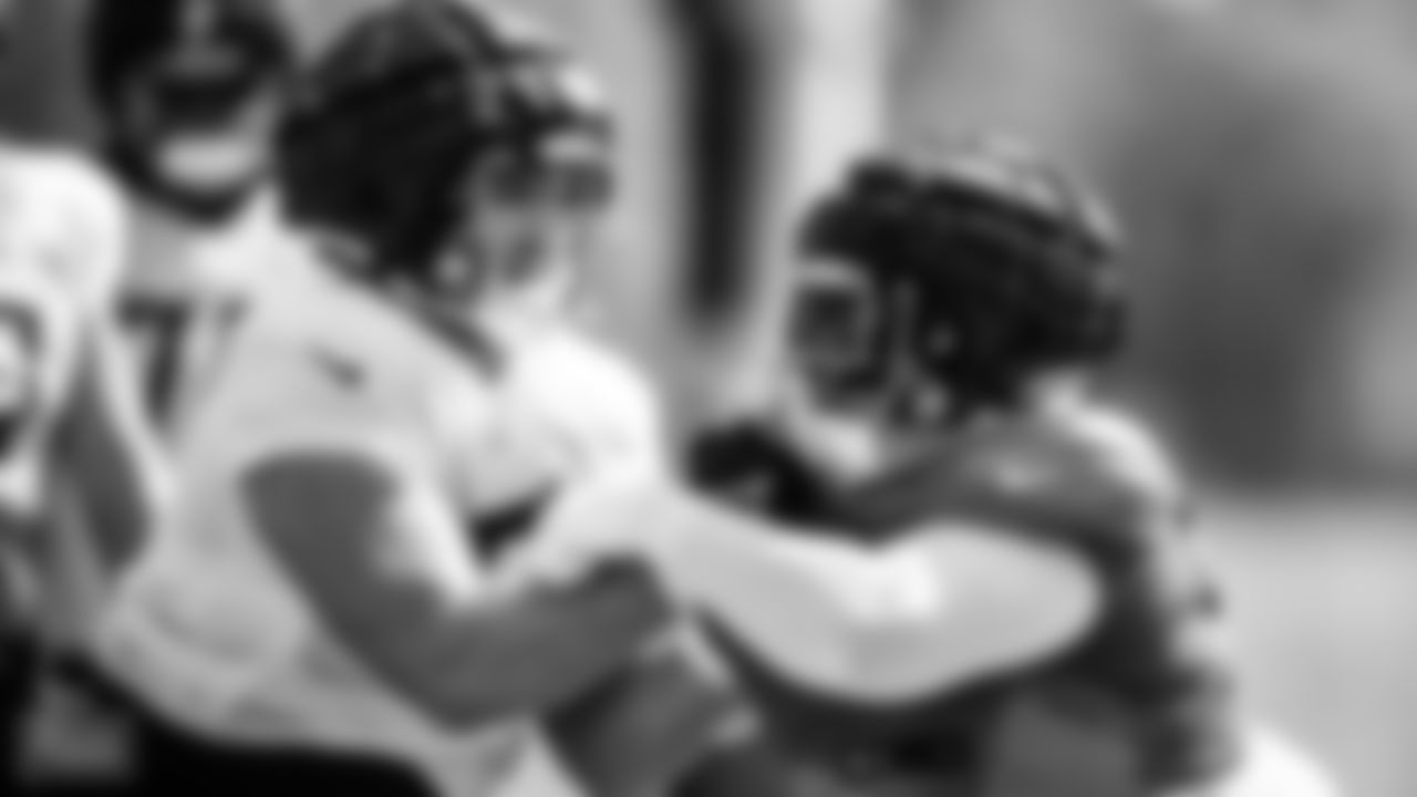 Offensive lineman Peter Skoronski #77 of the Tennessee Titans and Defensive end Sam Okuayinonu #59 of the Tennessee Titans during fall camp practice at the Ascension Saint Thomas Sports Park in Nashville, TN. Photo By Donald Page/Tennessee Titans