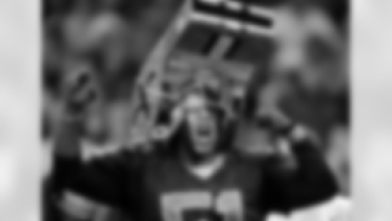 A New Orleans Saints fan cheers during an NFL preseason football game against the Tennessee Titans at the Louisiana Superdome in New Orleans, Thursday, Sept. 1, 2011. (AP Photo/Bill Feig)