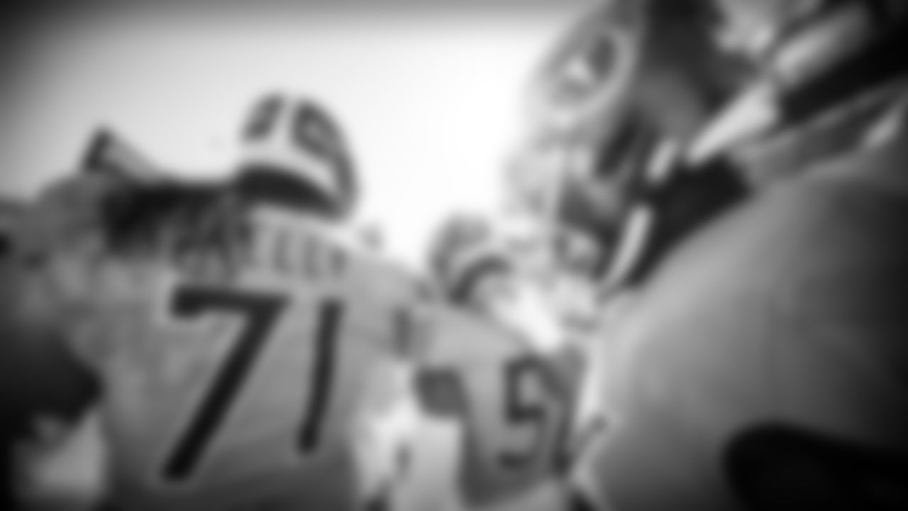 Tackle Dennis Kelly #71 of the Tennessee Titans, Outside linebacker Wyatt Ray #57 of the Tennessee Titans and Offensive lineman Nate Davis #64 of the Tennessee Titans in a huddle during warm ups before the game between the Tennessee Titans and the Chicago Bears at Nissan Stadium on NOVEMBER 08, 2020 in Nashville, TN. Photo By Donald Page/Tennessee Titans