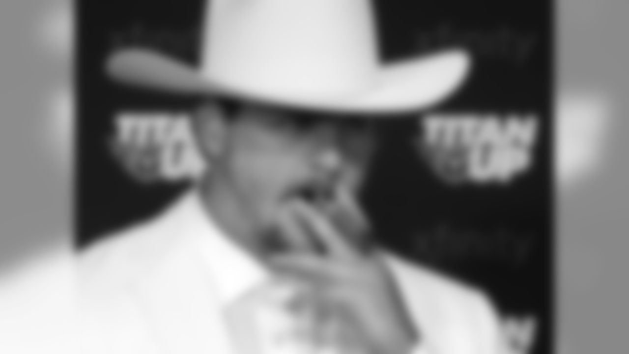 Tennessee Titans offensive tackle Taylor Lewan appears at a news conference dressed as Boss Hogg, a character from the television series "The Dukes of Hazard," after a practice during NFL football training camp Friday, July 27, 2018, in Nashville, Tenn. Lewan, a two-time Pro Bowl player, signed a contract extension reportedly worth $80 million with $50 million guaranteed on Friday, making him the NFL's highest-paid offensive lineman to date. (AP Photo/Mark Humphrey)