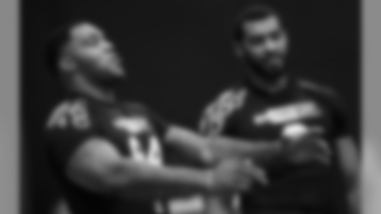 Former Mississippi State defensive players Jeffery Simmons, left, and Montez Sweat, joke around during Pro Day at the university, as other players were being tested by NFL football scouts and coaches, Wednesday, March 27, 2019, in Starkville, Miss. Sweat ran some agility drills, while Simmons stayed on the sidelines as he recovers from a leg injury. (AP Photo/Rogelio V. Solis)