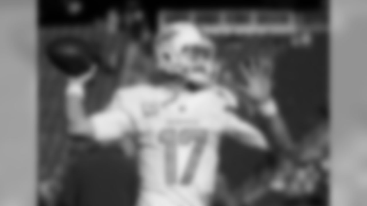 Miami Dolphins quarterback Ryan Tannehill warms up before an NFL football game against the New England Patriots Sunday, Dec. 14, 2014, in Foxborough, Mass. (AP Photo/Steven Senne)