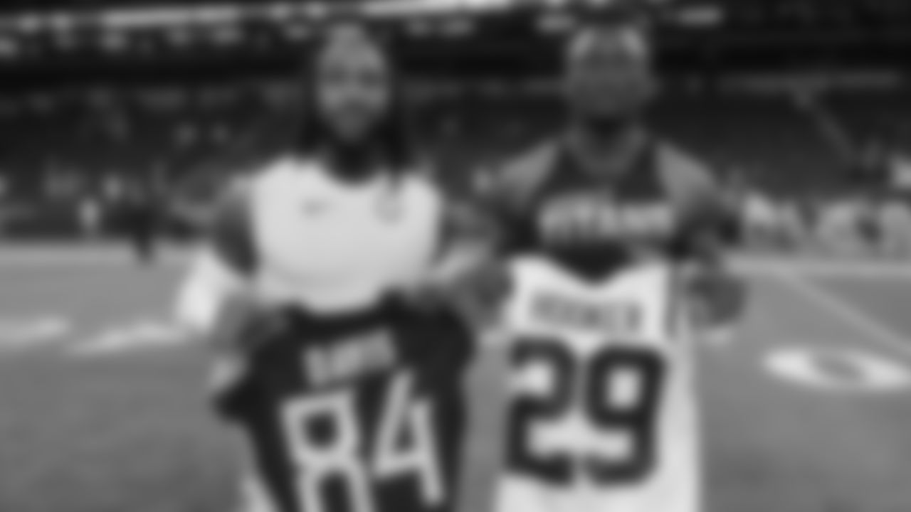 Tennessee Titans wide receiver Corey Davis (84) and Indianapolis Colts free safety Malik Hooker (29) exchange jerseys following an NFL football game in Indianapolis, Sunday, Dec. 1, 2019. The Titans defeated the Colts 31-17. (AP Photo/Darron Cummings)