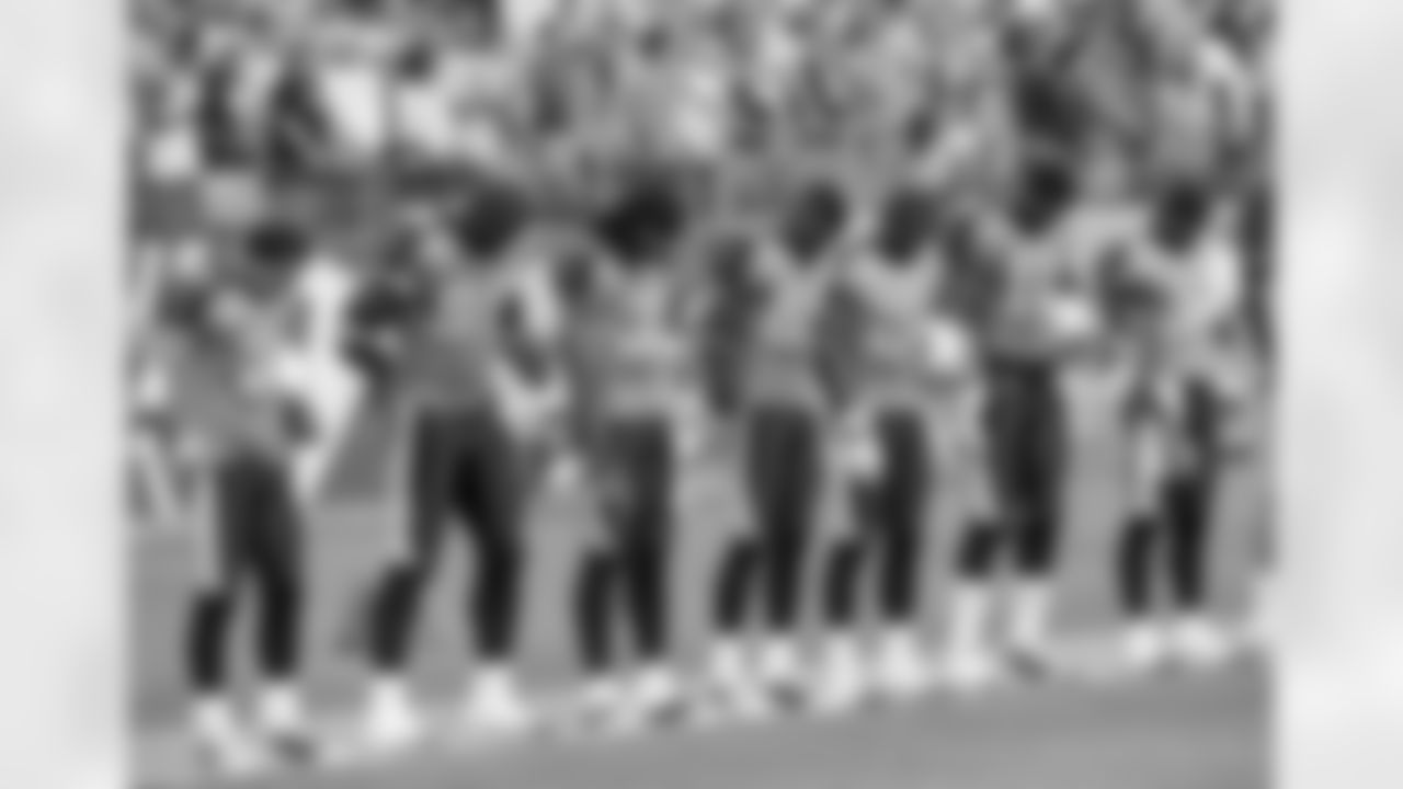 Tennessee Titans players take part in a moment of silence in memory of former Titans quarterback Steve McNair before the start of an NFL pre-season football game against the Tampa Bay Buccaneers in Nashville, Tenn., Saturday, Aug. 15, 2009. McNair was shot to death July 4. (AP Photo/John Russell)