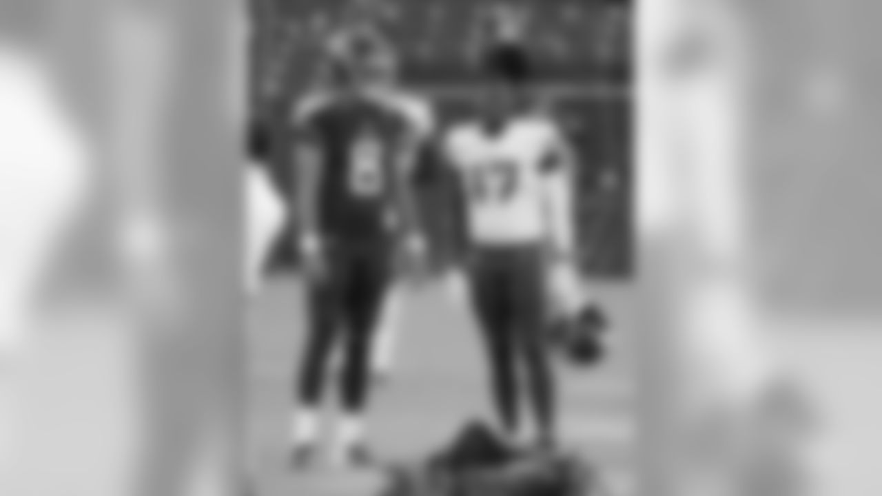 Tennessee Titans quarterback Marcus Mariota (8) talks with Minnesota Vikings wide receiver and former Titan Kendall Wright (17) before a preseason NFL football game Thursday, Aug. 30, 2018, in Nashville, Tenn. (AP Photo/Mark Zaleski)